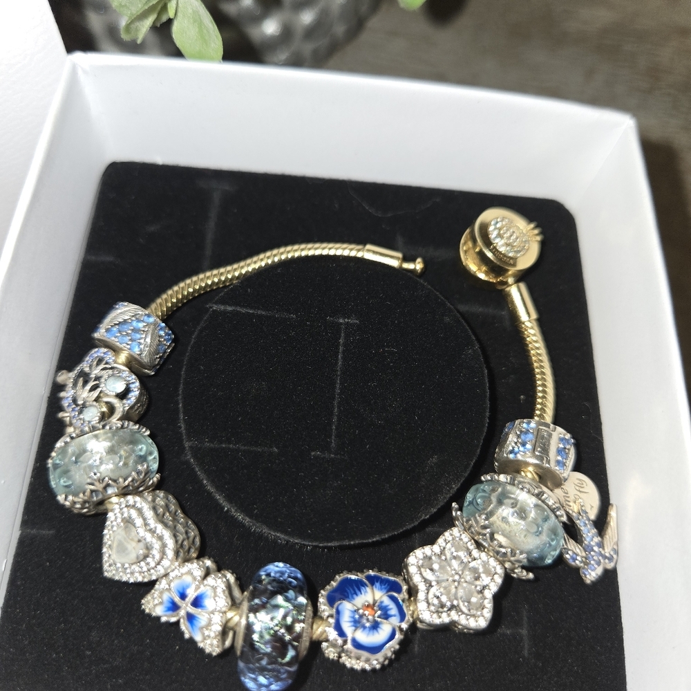 Like New Gold Plated Pandora braclet- Gold and Blue Freedom & blossom Theme